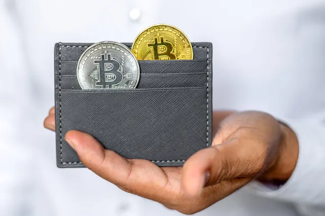 Illustration of a smartphone showing a crypto wallet app with keys and coins