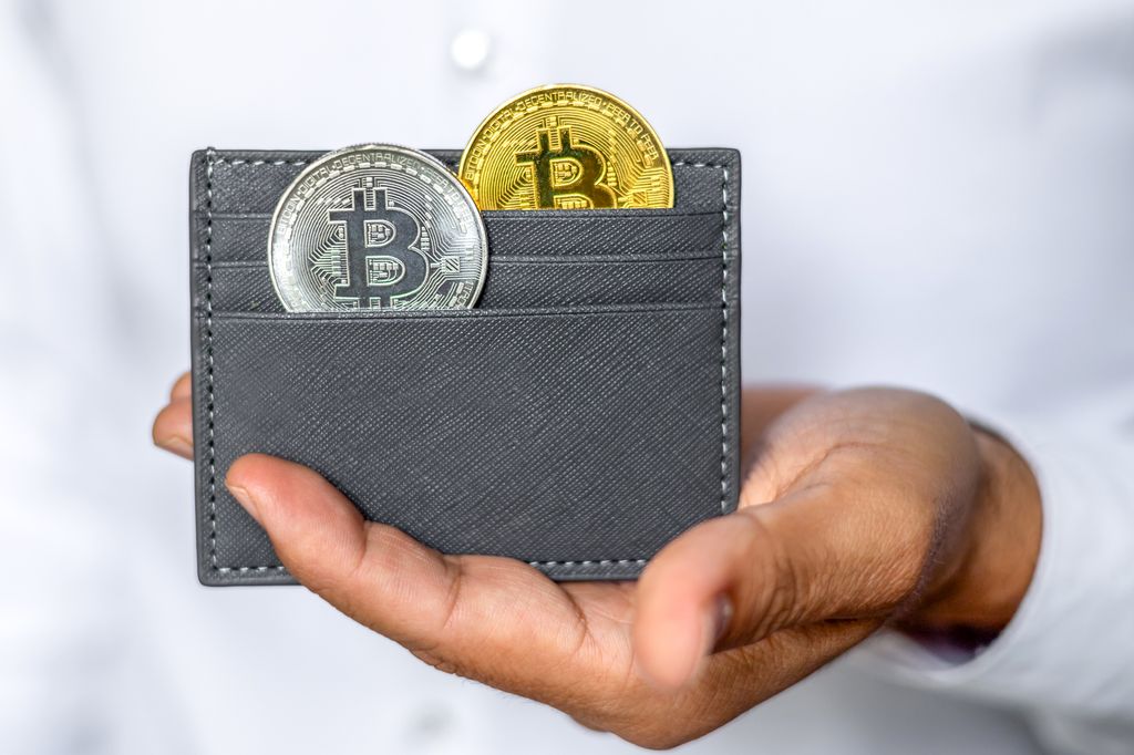 Illustration of a smartphone showing a crypto wallet app with keys and coins