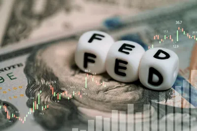 Illustration of the Federal Reserve building with arrows pointing to savings, credit card, and mortgage icons